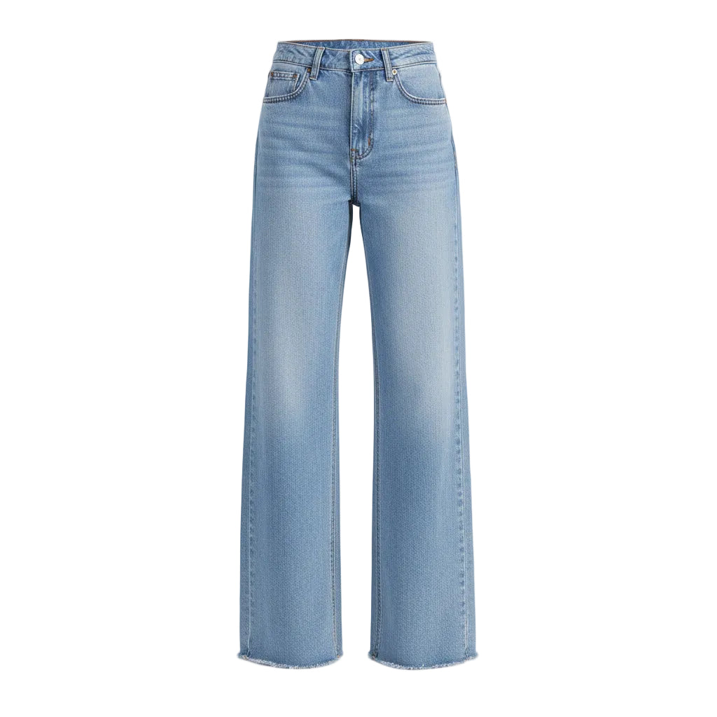Person wearing light blue jeans on a plain background
