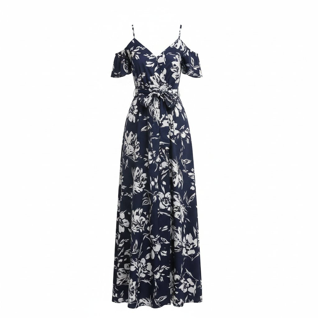 Woman wearing a navy floral dress with a white background