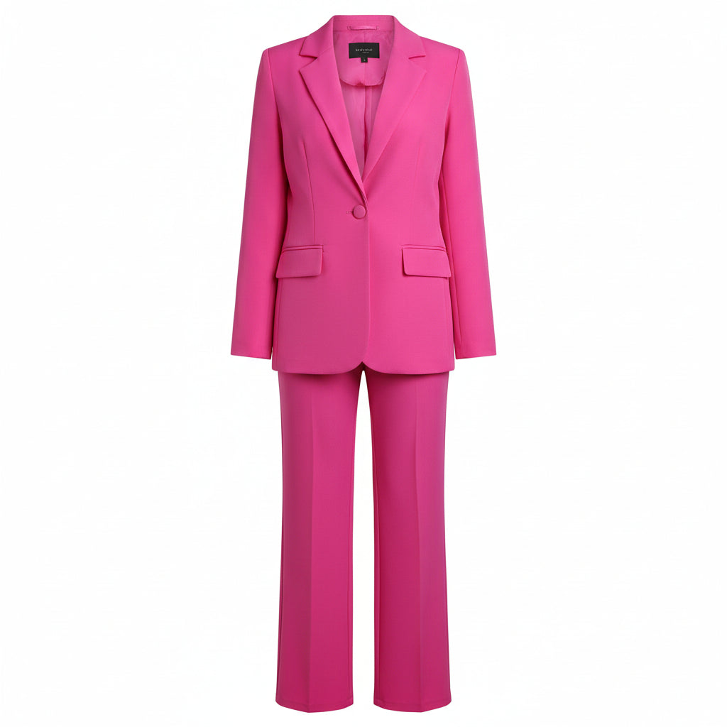 Person wearing a bright pink suit against a plain background