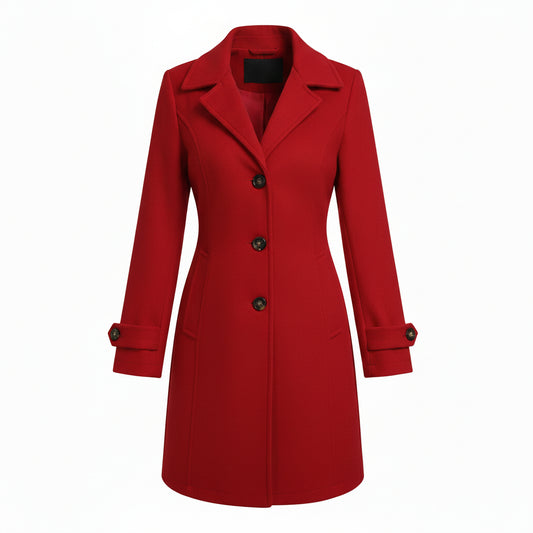 Woman wearing a red coat, white top, blue jeans, and beige hat against a wooden background.