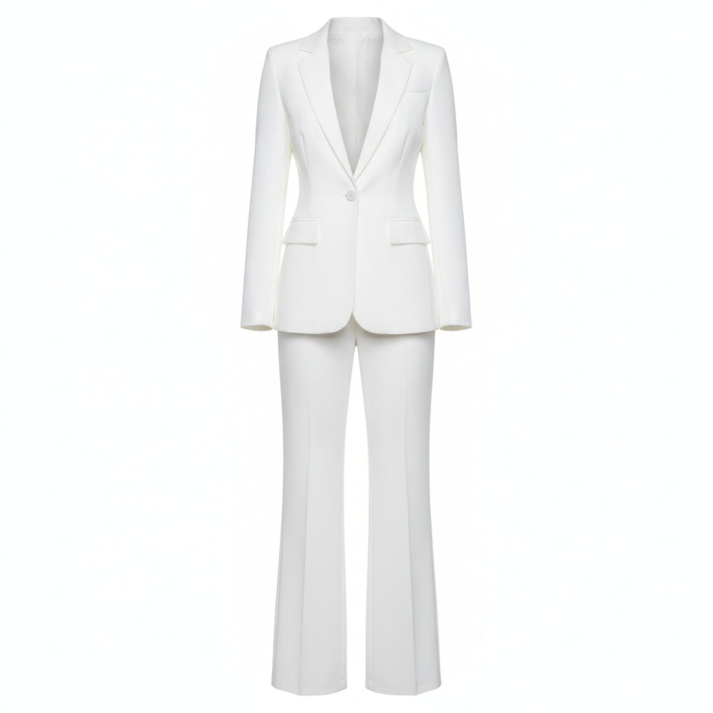 Person wearing a white suit against a plain background