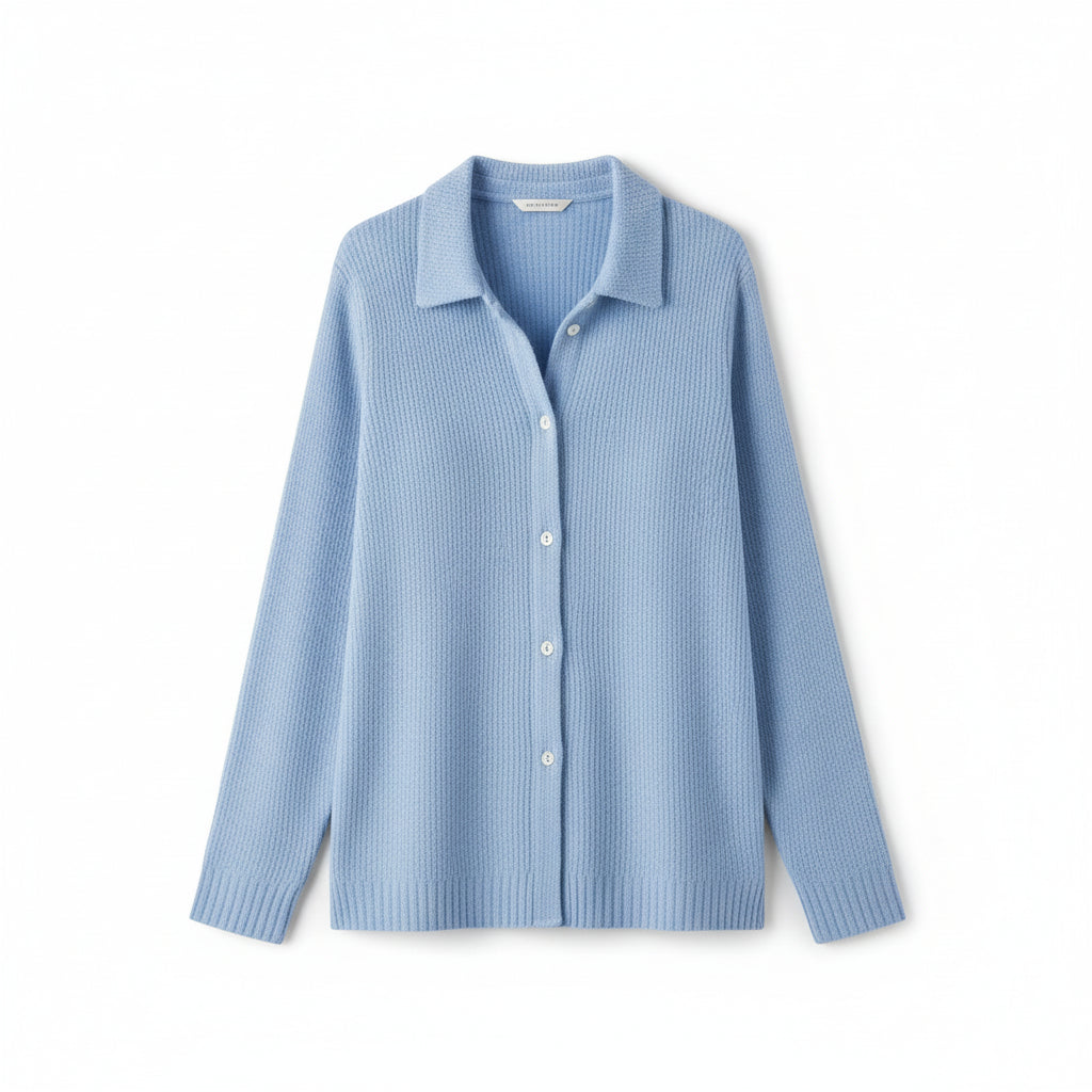 Blue button-up sweater worn by a person on a plain background