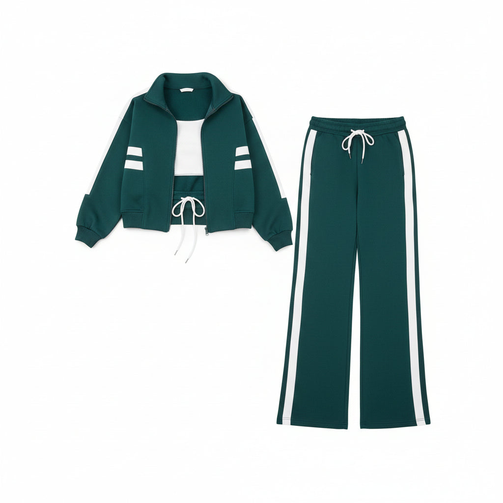 Woman wearing a teal tracksuit with white stripes in an indoor setting.