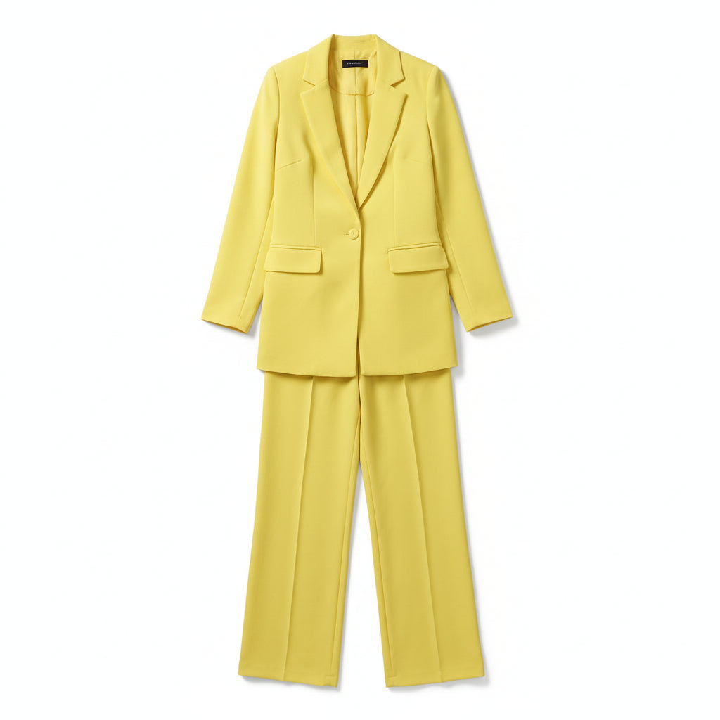 Person wearing a bright yellow suit against a plain background