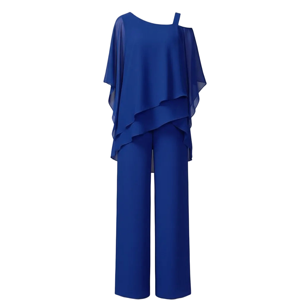 Woman wearing a blue outfit with a blurred indoor background