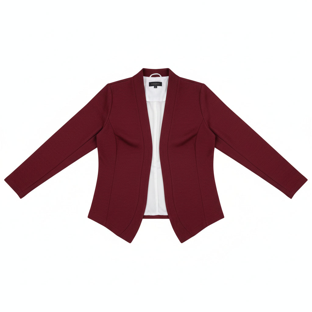 Woman taking a selfie wearing a red blazer over a white top and blue pants.