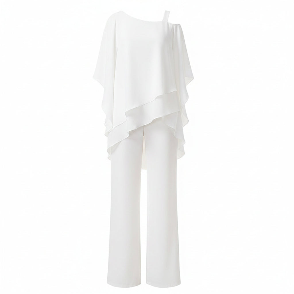 Woman wearing a white outfit with a blurred indoor background