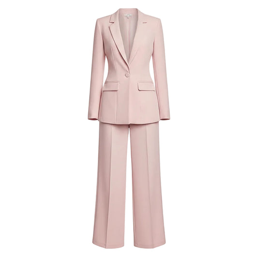 Person wearing a light pink suit against a plain background