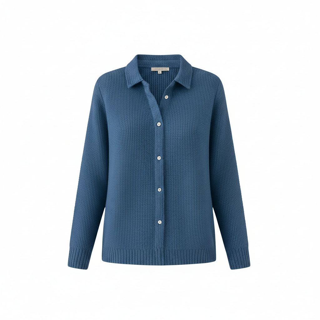 Blue button-up sweater worn by a person on a white background